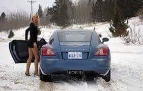 A blonde driving a car became lost in a snowstorm.
